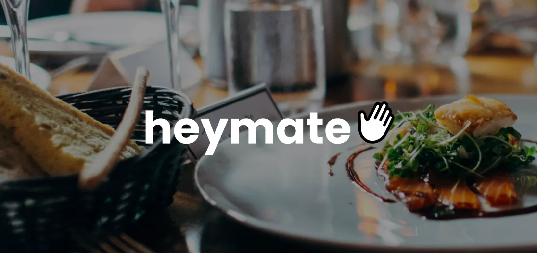 Heymate logo over a restaurant dining scene