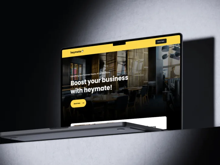 Heymate business website displayed on a desktop monitor
